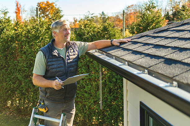 Professional Storm Damage Roof Repair technician working in Maxwell, IA